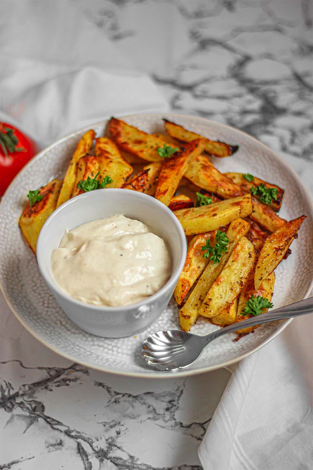 Extra crispy baked potatoes with vegan mayonnaise