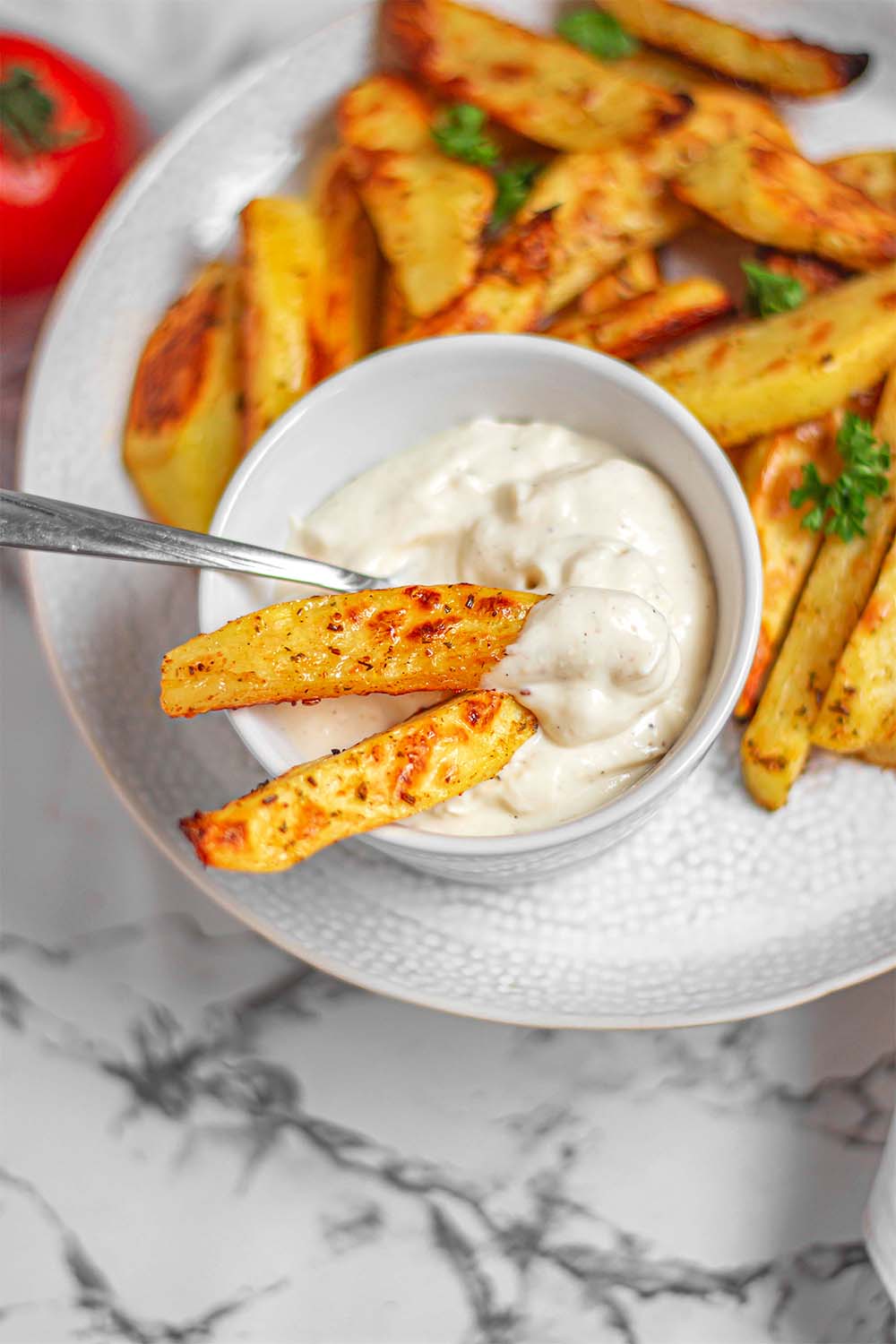 Extra crispy baked potatoes with vegan mayonnaise