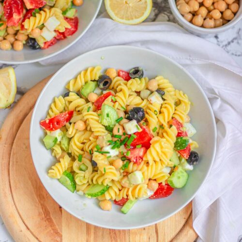 A bowl of vegan pasta salad with veggies