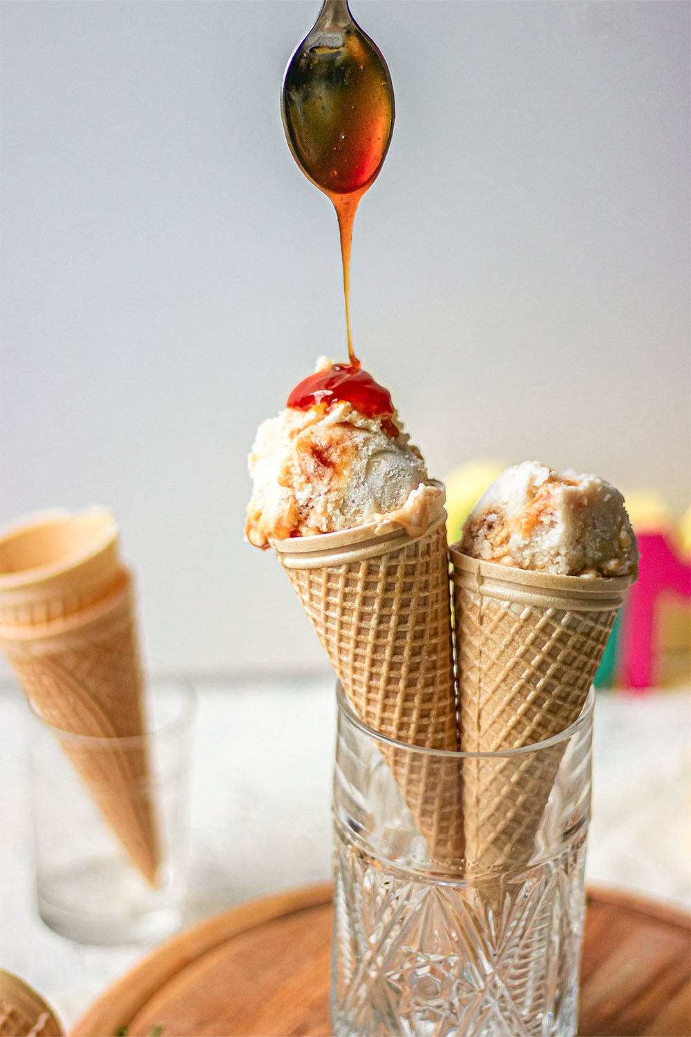 ice cream being decorated with caramel